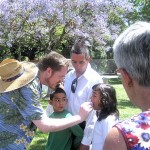 Rev. Mike serves communion at Pride